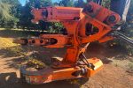 an orange machine with a large arm